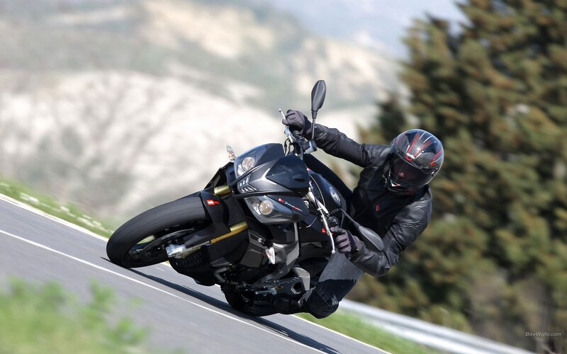 Motorcycle rider on a winding road