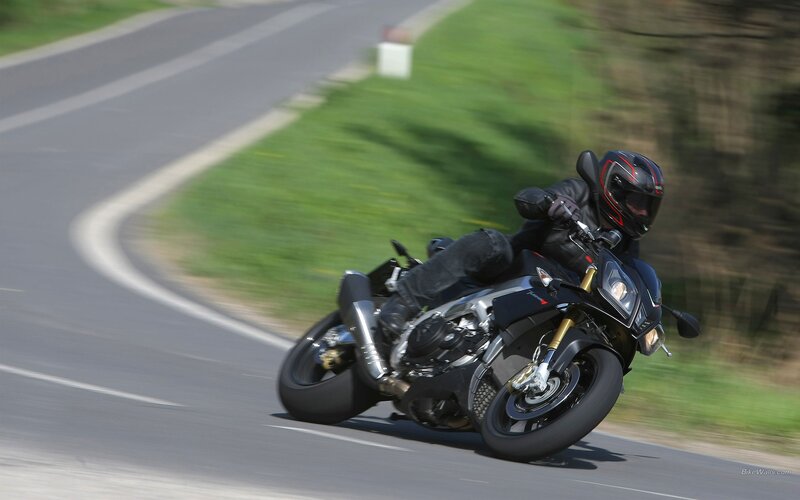motorcycle rider on a winding road