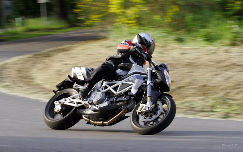Motorcycle rider on a winding road