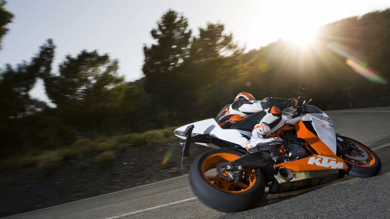 Motorcycle rider on a winding road