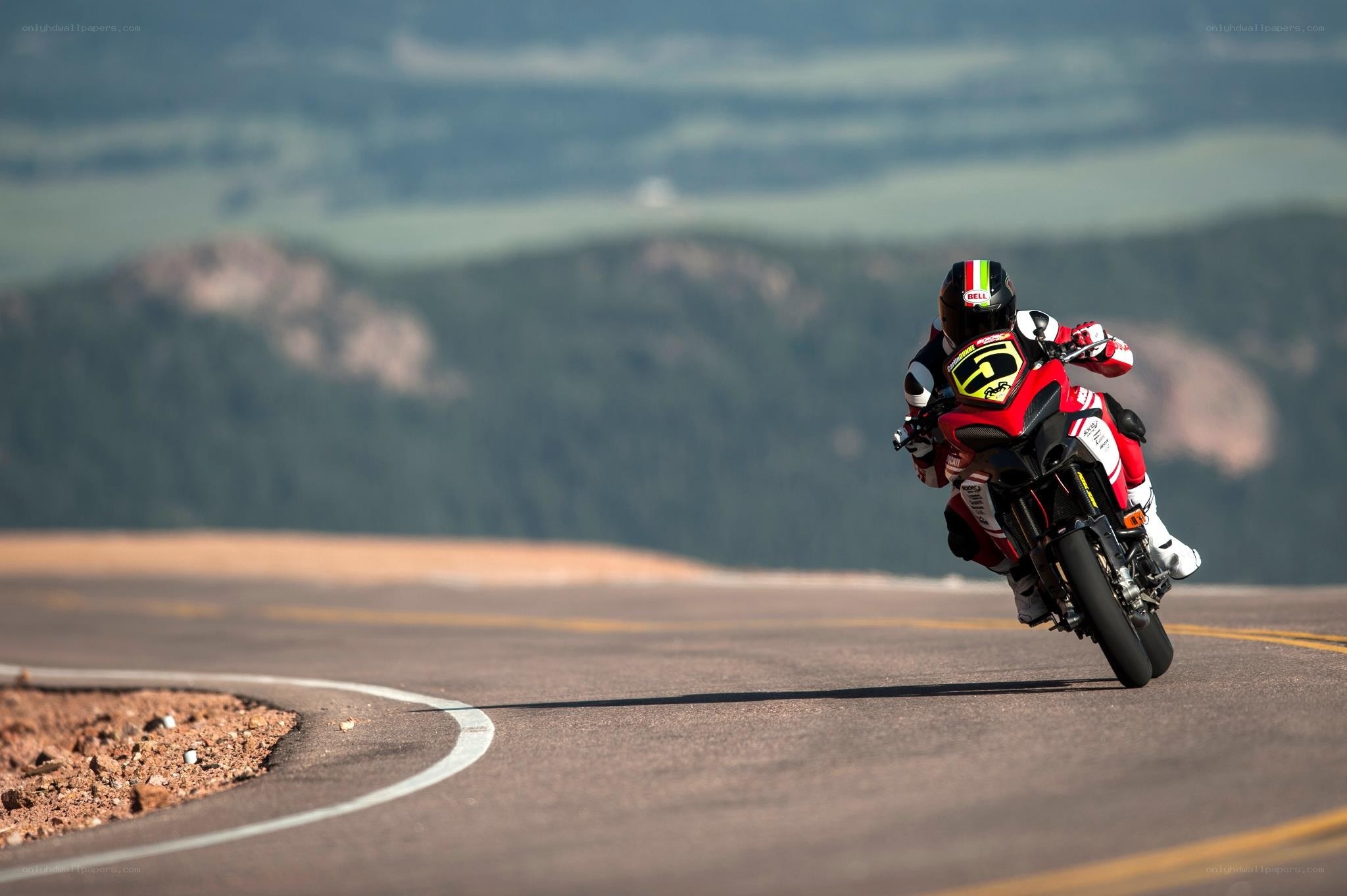 Motorcycle rider on a winding road