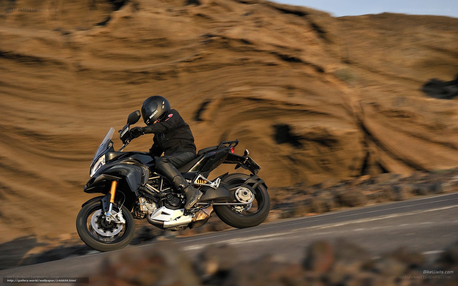 motorcycle rider on a winding road