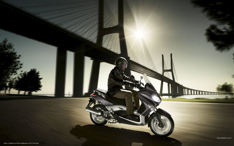 Motorcycle rider on bridge
