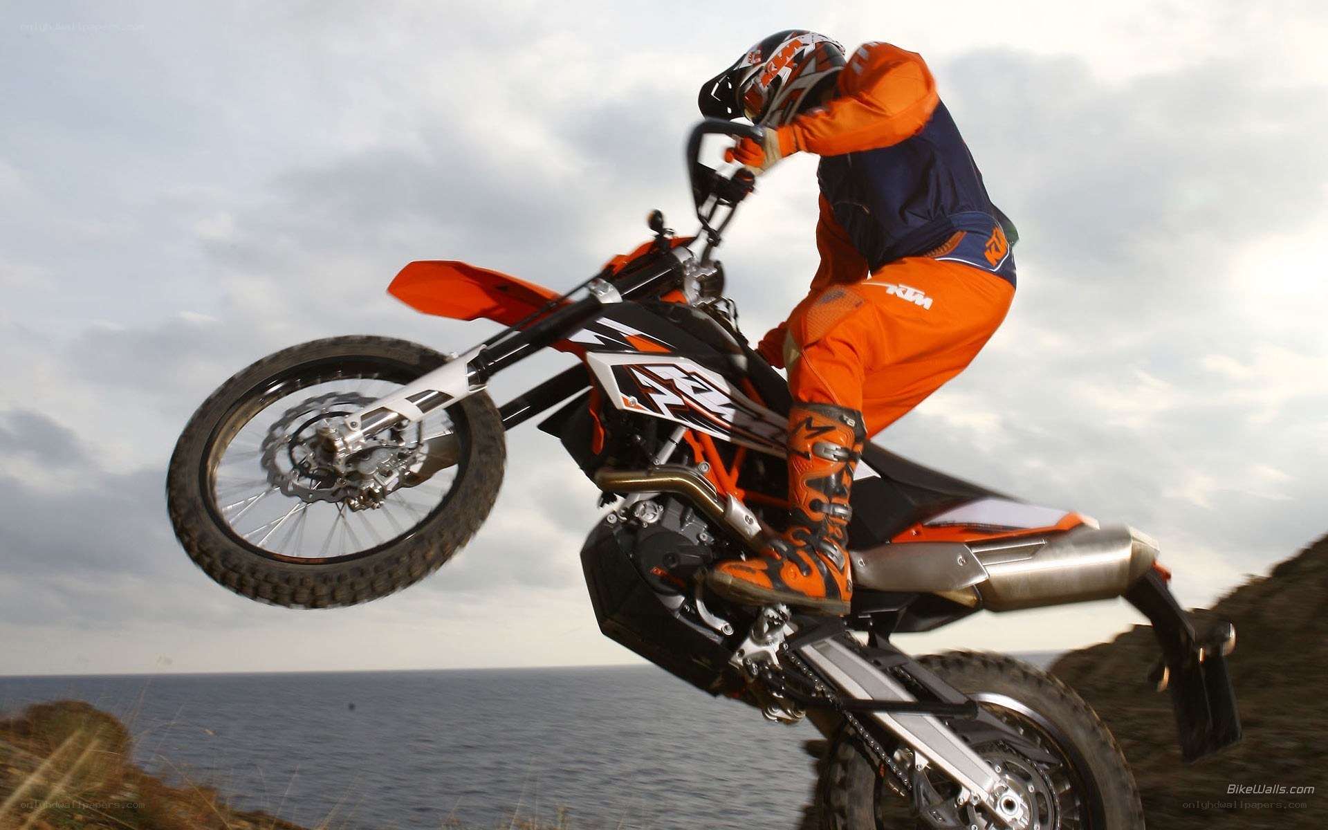 motorcycle rider on cliff edge