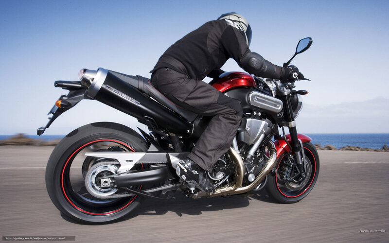 motorcycle rider on coastal road
