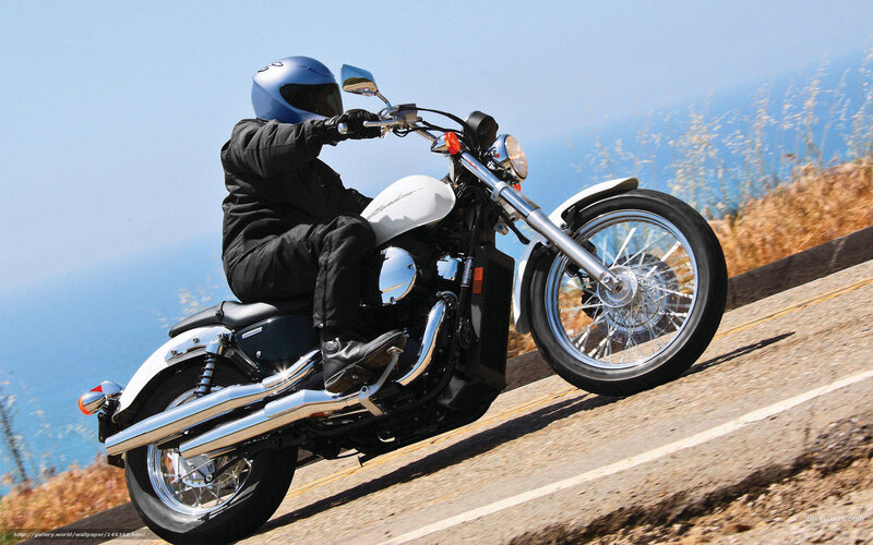 Motorcycle rider on coastal road