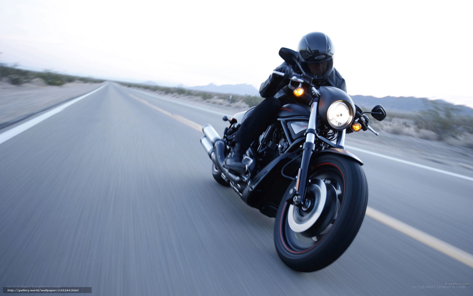 motorcycle rider on desert road