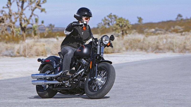 Motorcycle rider on desert road