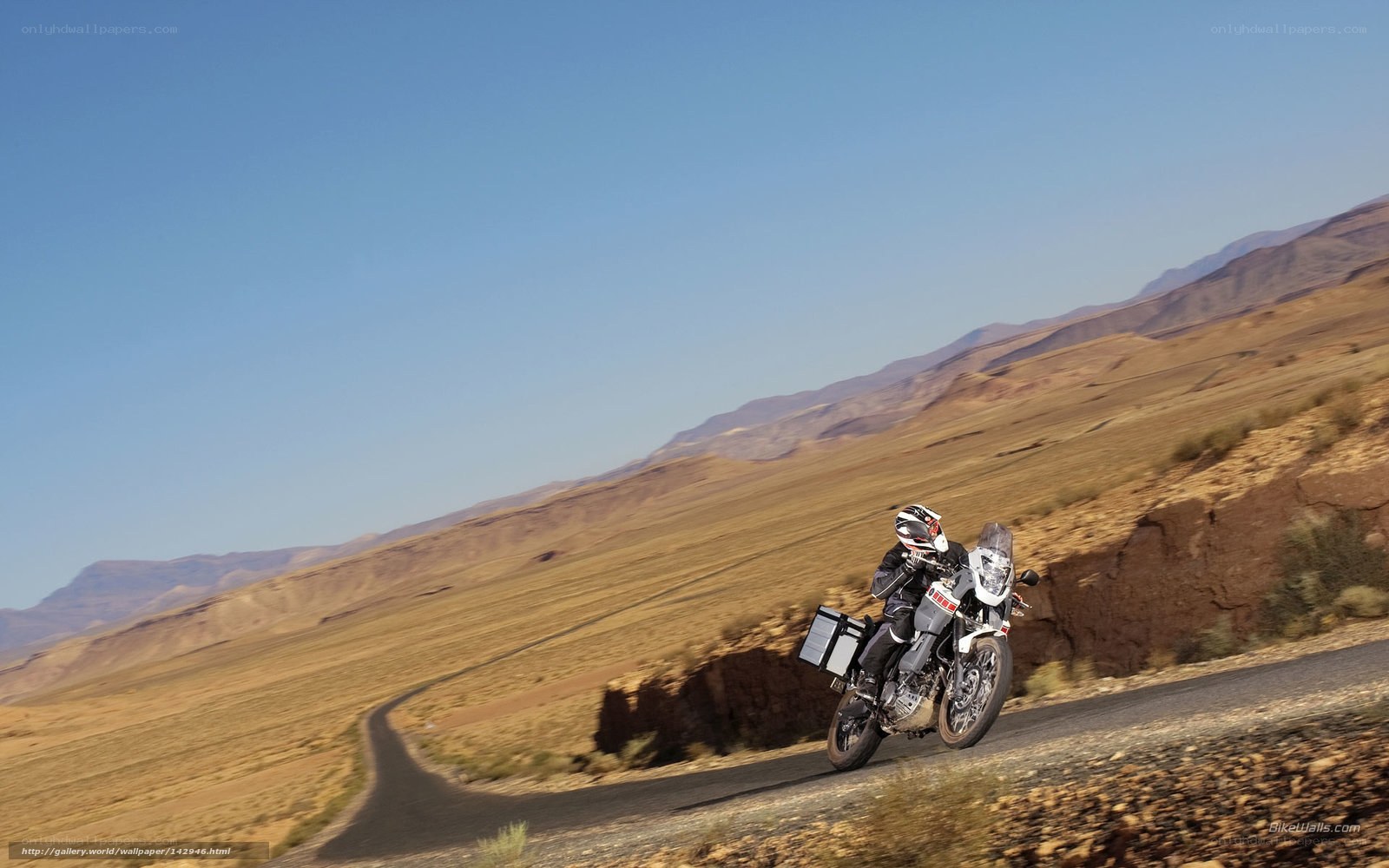 motorcycle rider on desert road