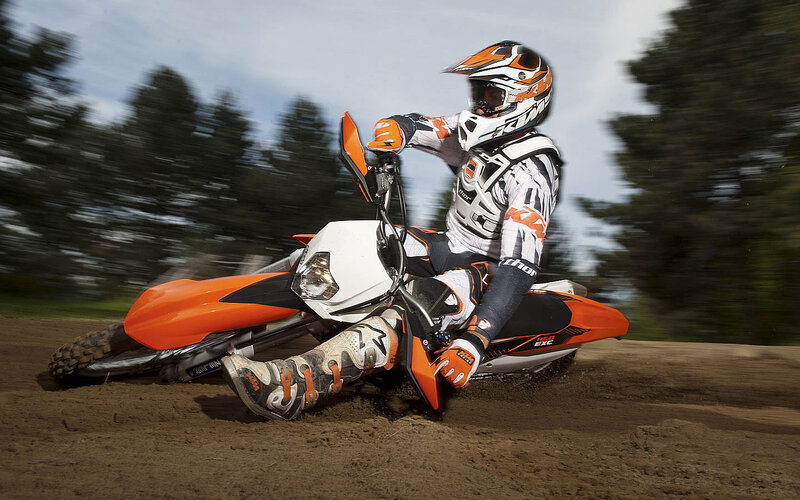 Motorcycle Rider on Dirt — Orange