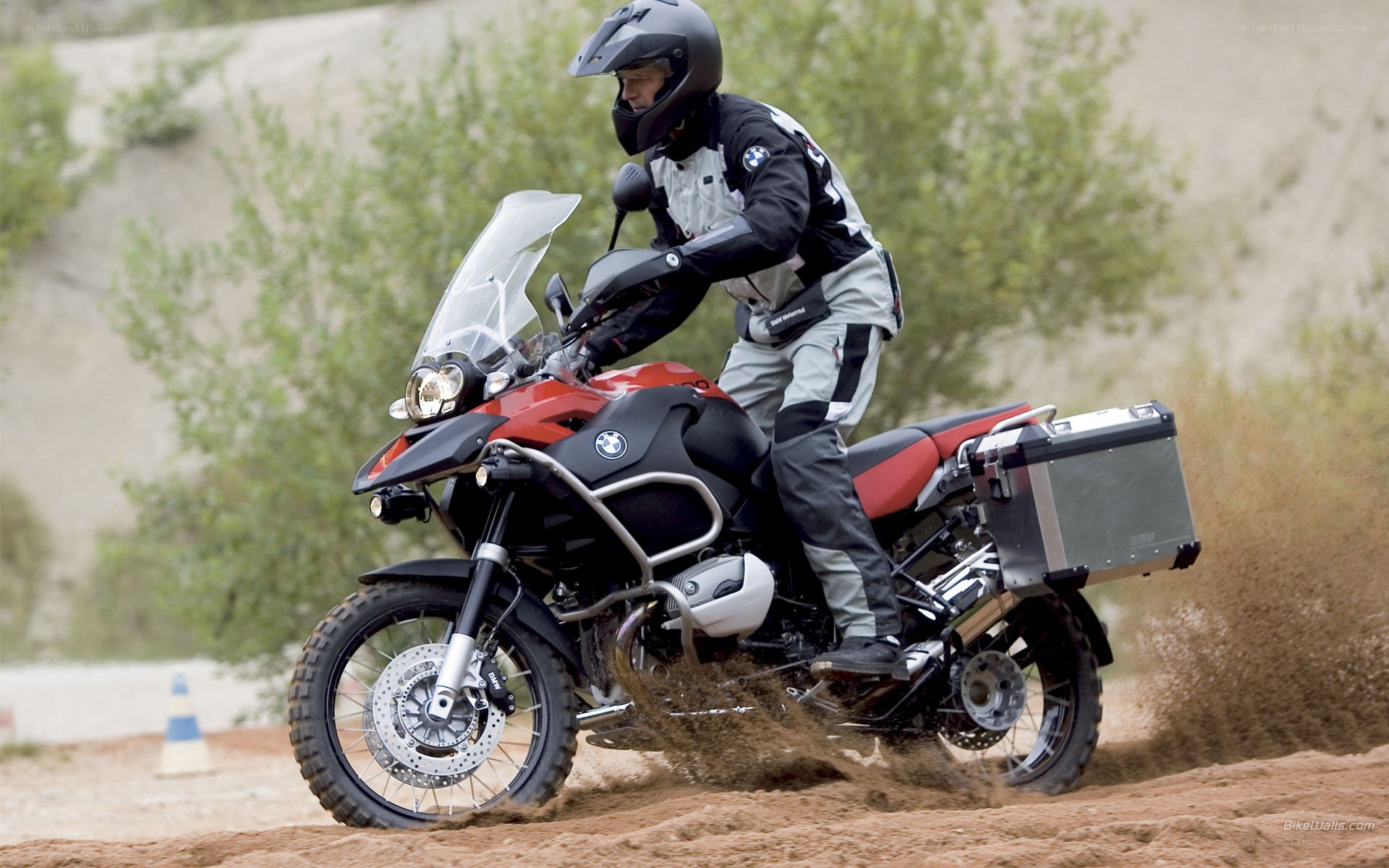 Motorcycle rider on dirt path
