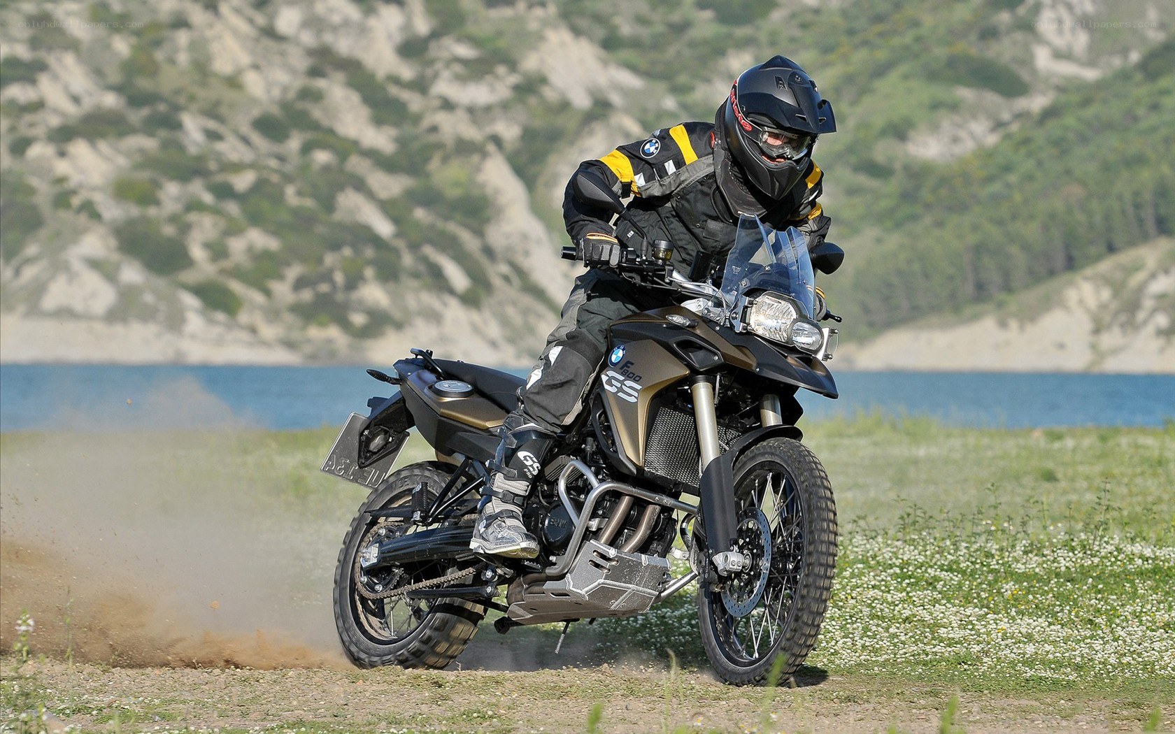 Motorcycle rider on dirt path