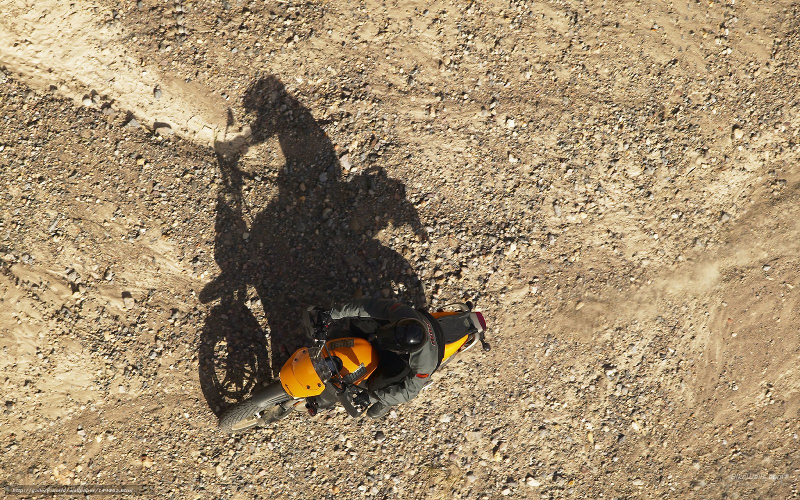 Motorcycle rider on dirt path