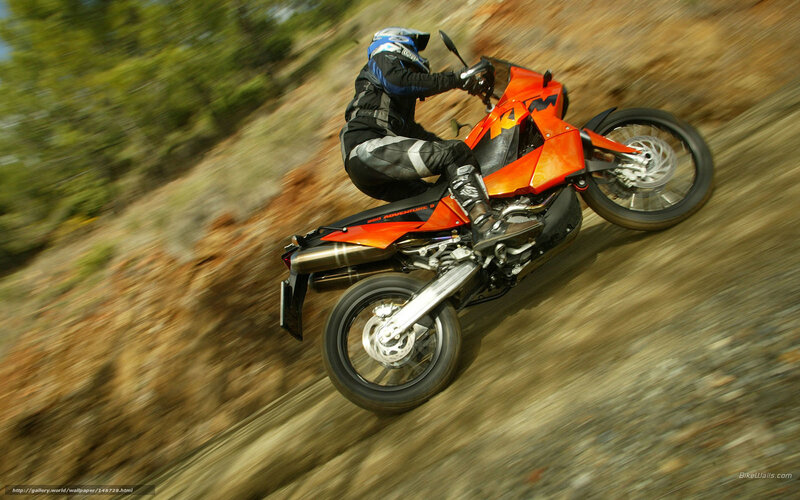 motorcycle rider on dirt path