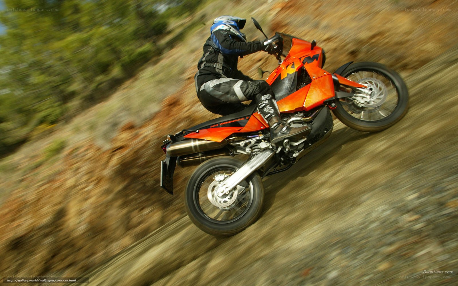 motorcycle rider on dirt path
