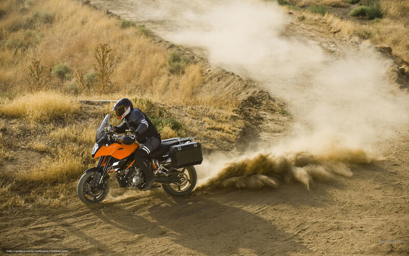 Motorcycle rider on dirt path
