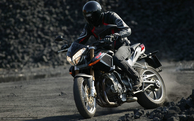 motorcycle rider on dirt path