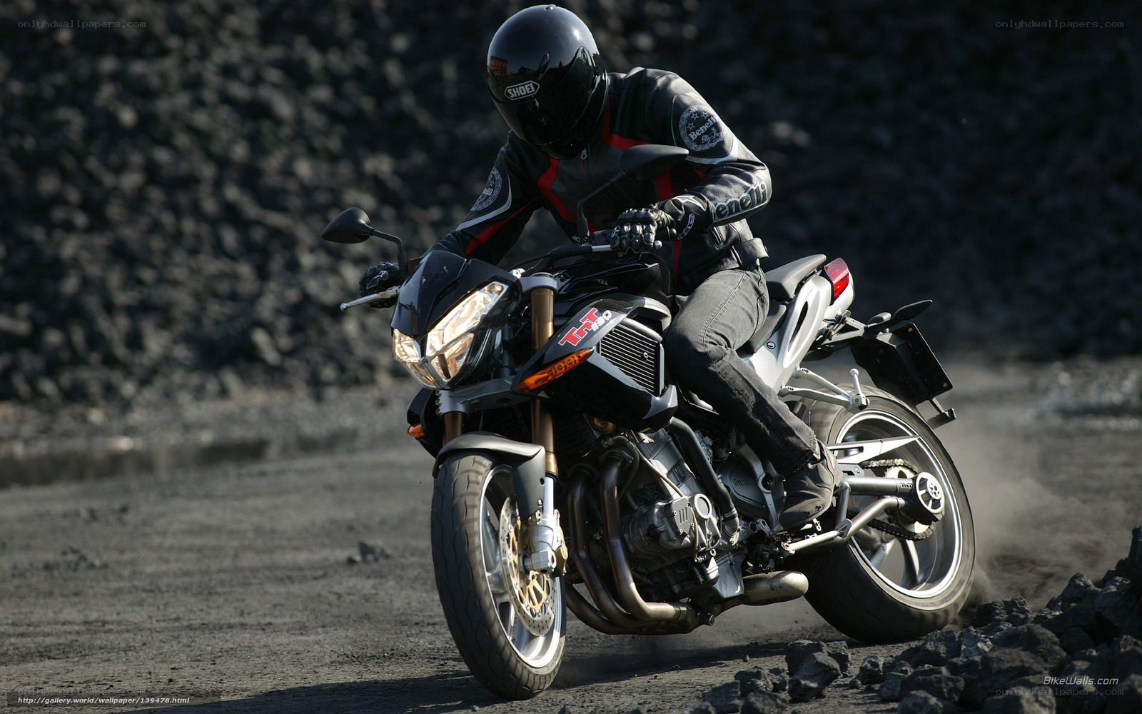 motorcycle rider on dirt path