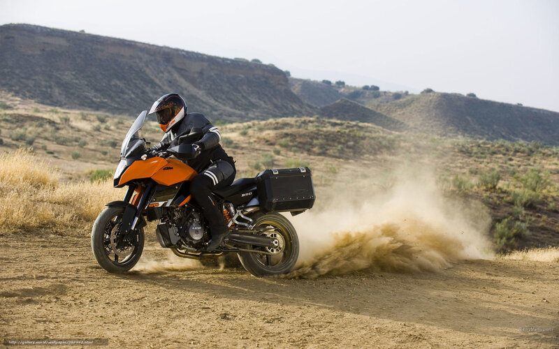 Motorcycle rider on dirt road
