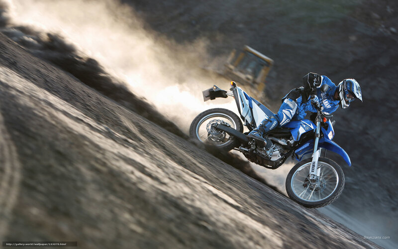 Motorcycle rider on dirt slope