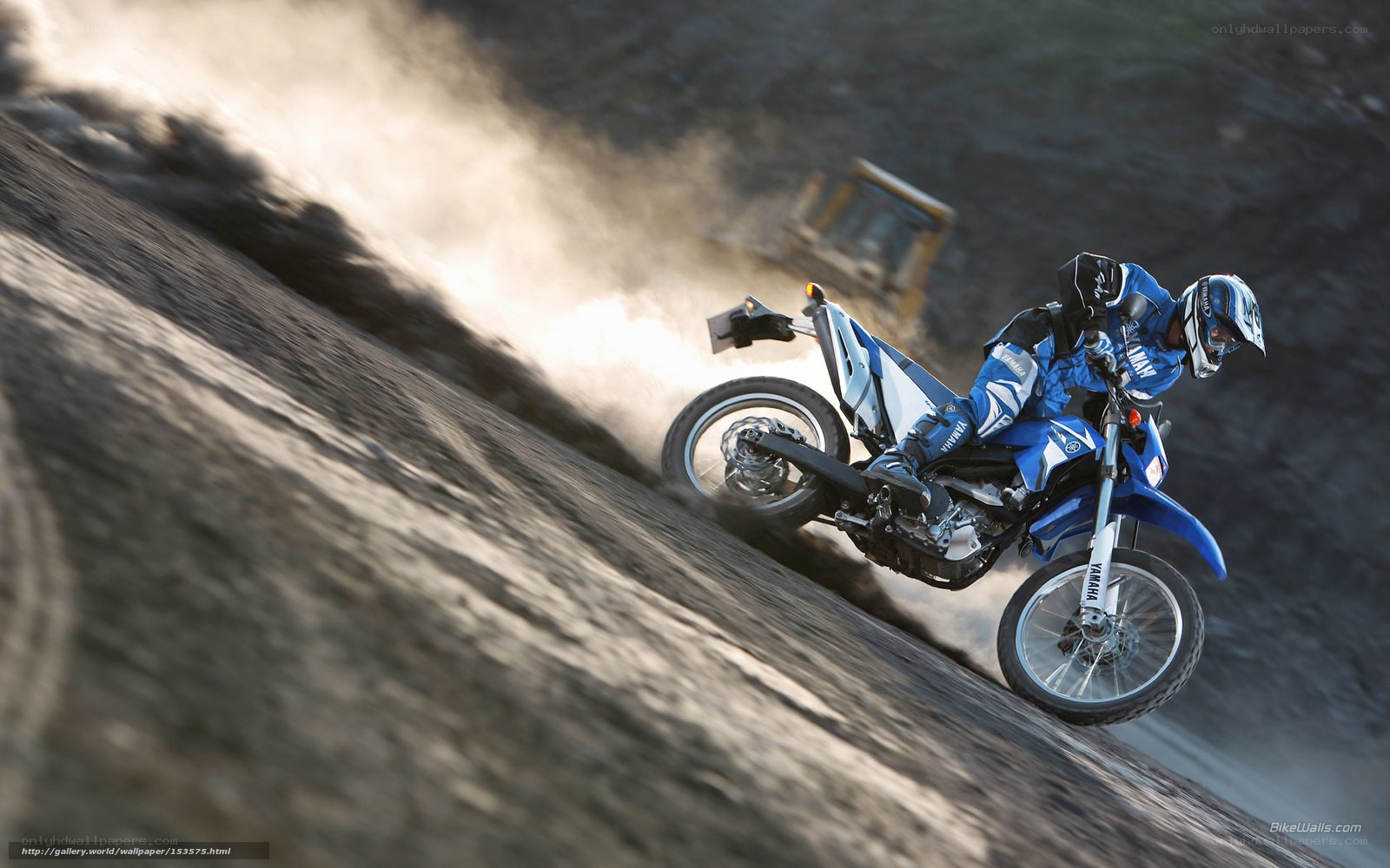 Motorcycle rider on dirt slope