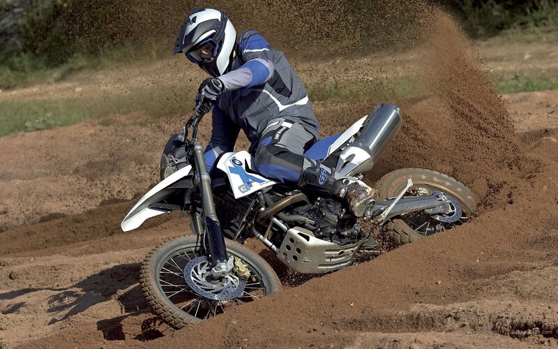 Motorcycle rider on dirt track