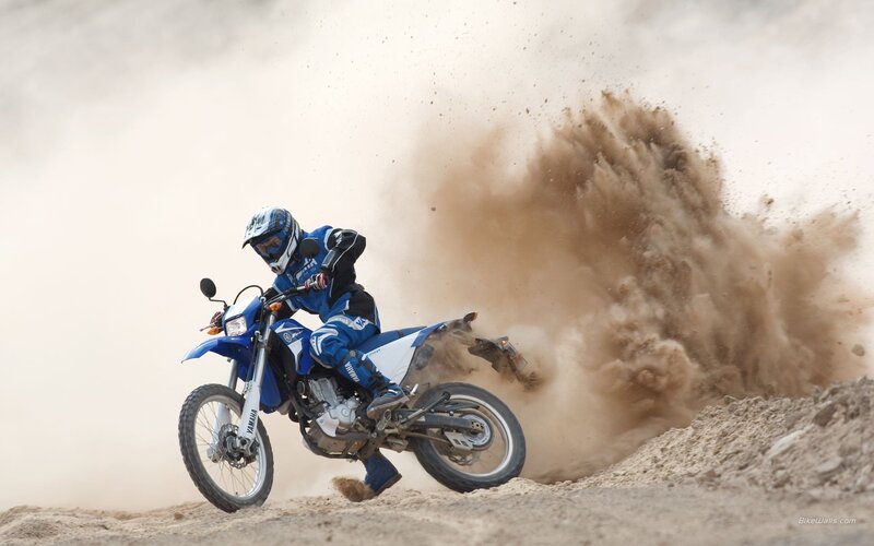 Motorcycle rider on dirt track