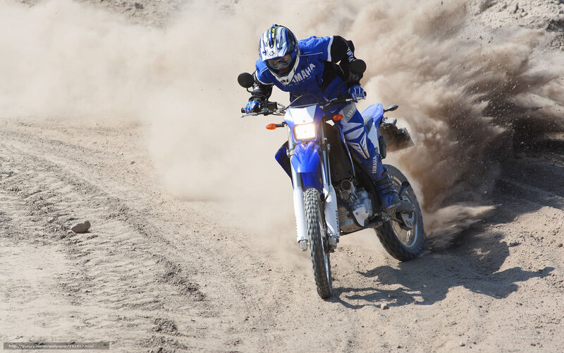 Motorcycle rider on dirt track