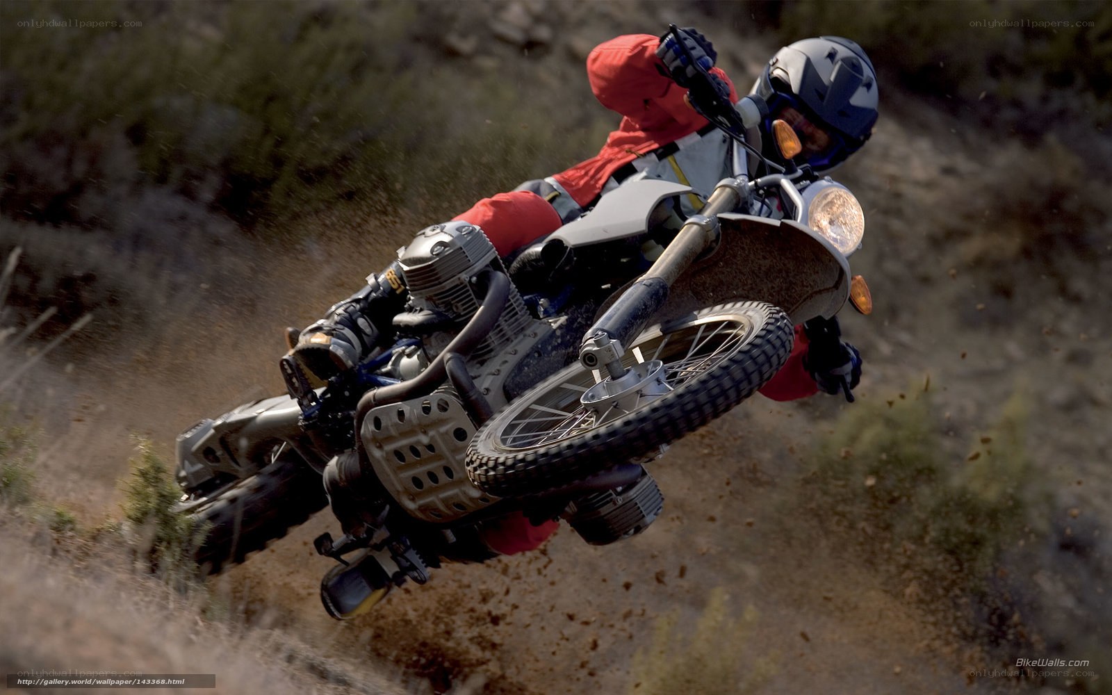 Motorcycle rider on dirt trail