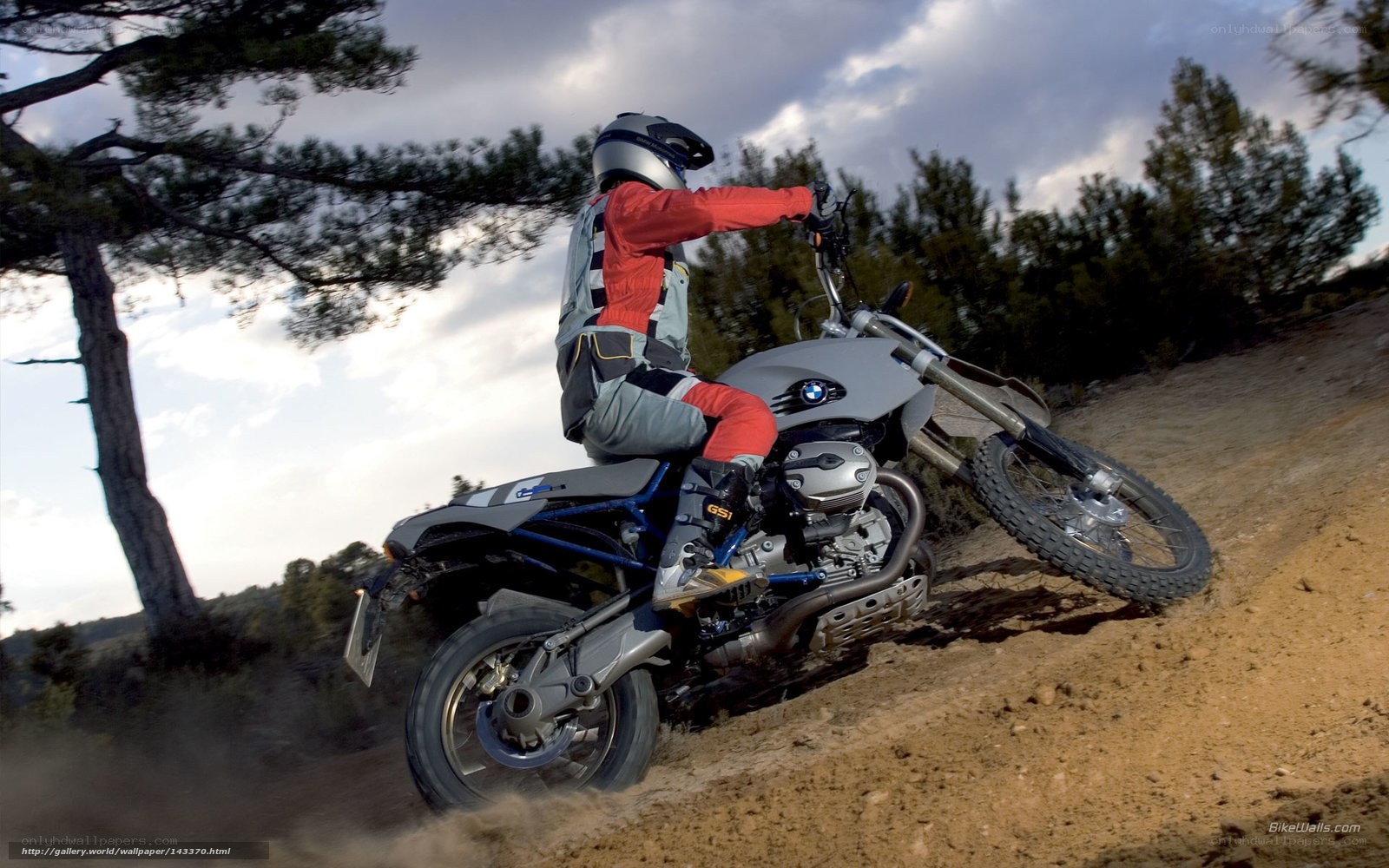 motorcycle rider on dirt trail
