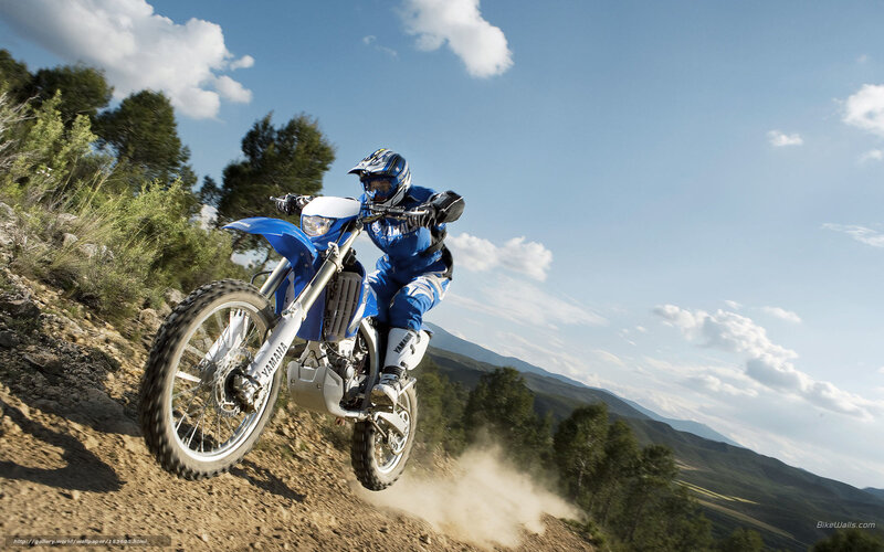 Motorcycle rider on dirt trail