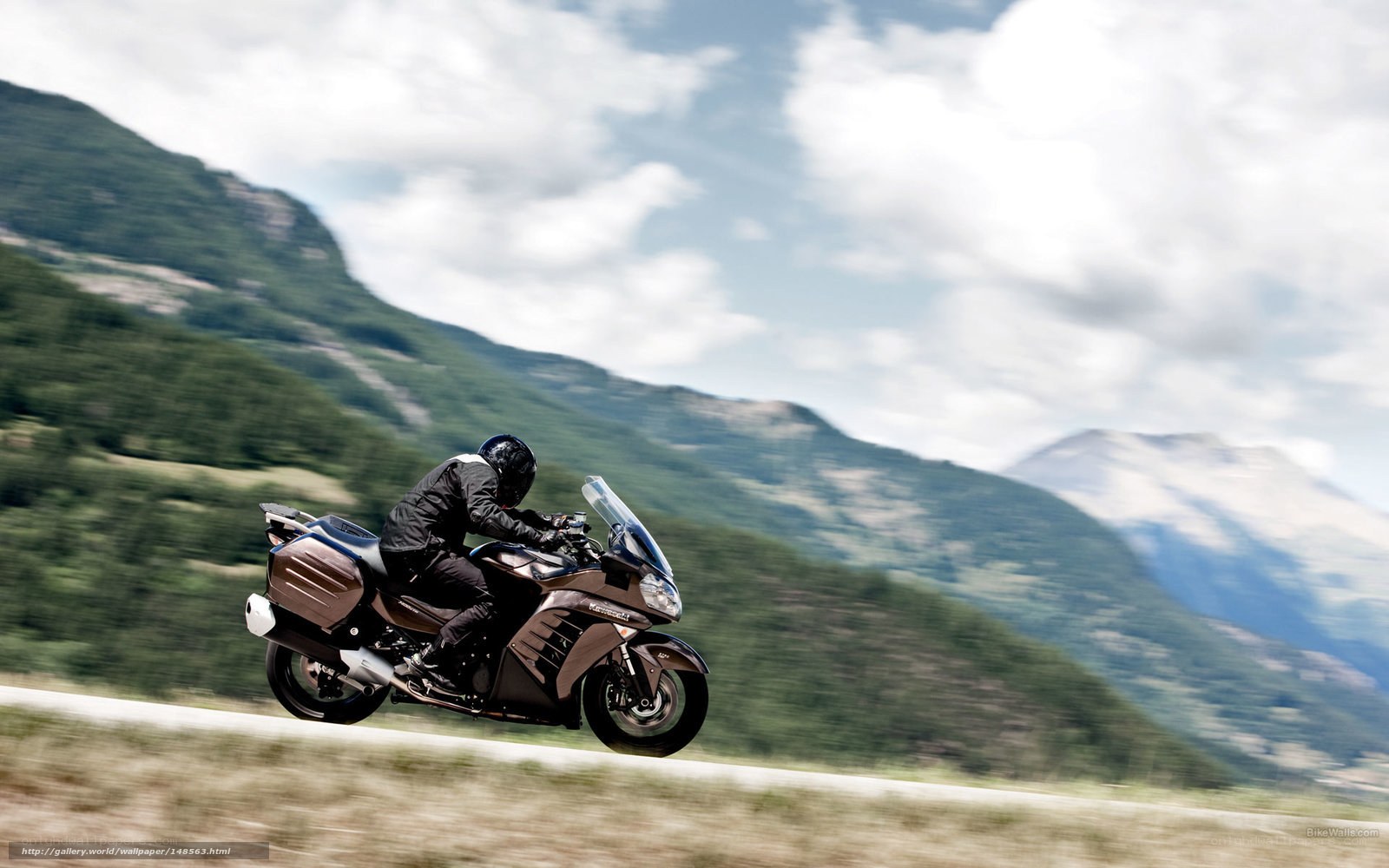 motorcycle rider on mountain road