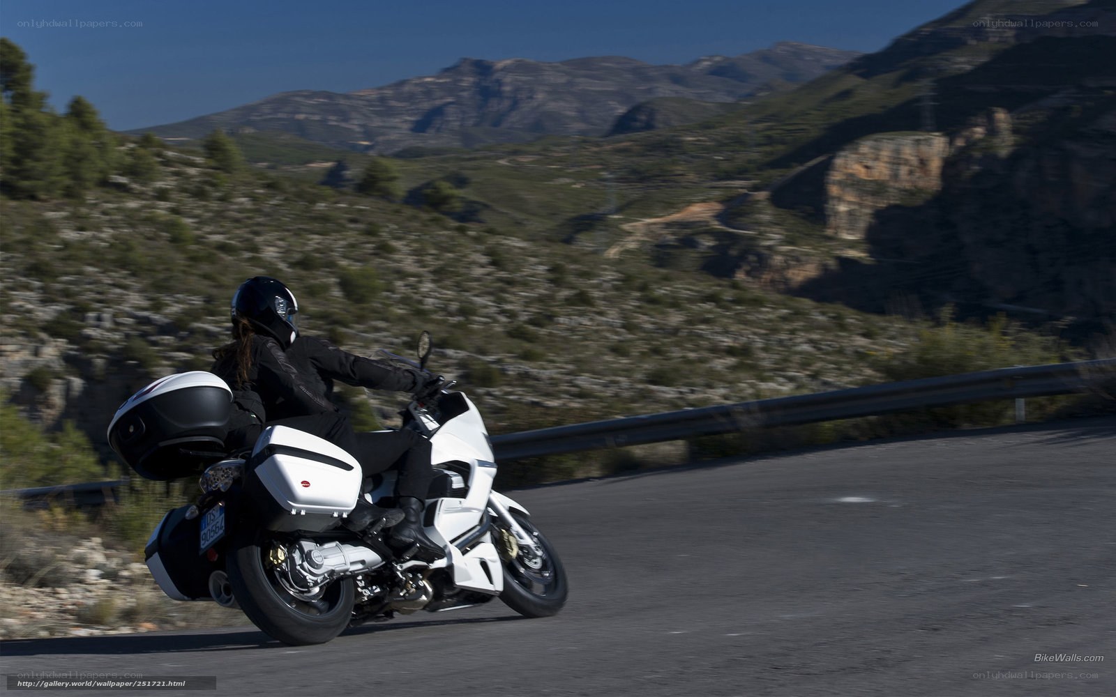 motorcycle rider on mountain road