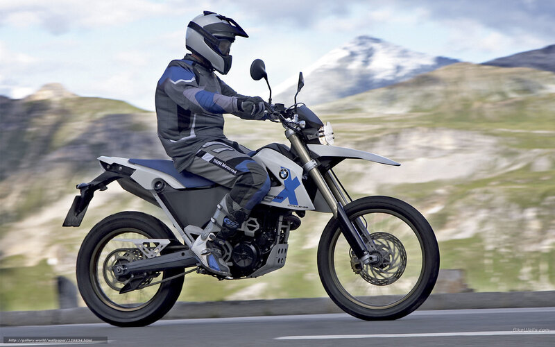 motorcycle rider on mountain road