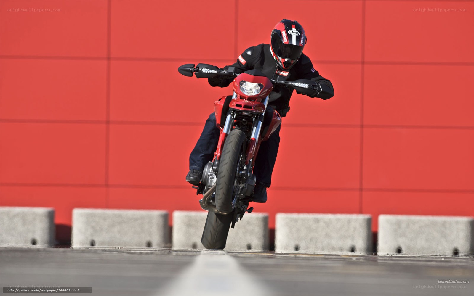 motorcycle rider on red bike