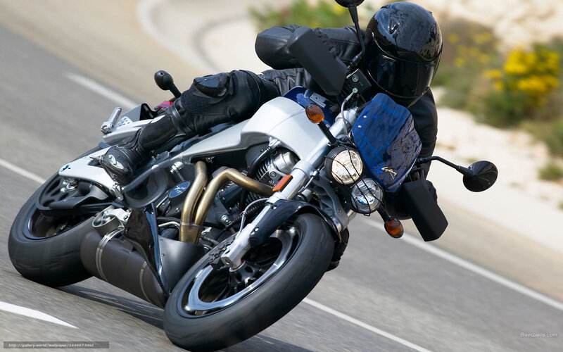 Motorcycle Rider on Road — Black, Dynamic, Afternoon, Photograph, Helmet, Bushes