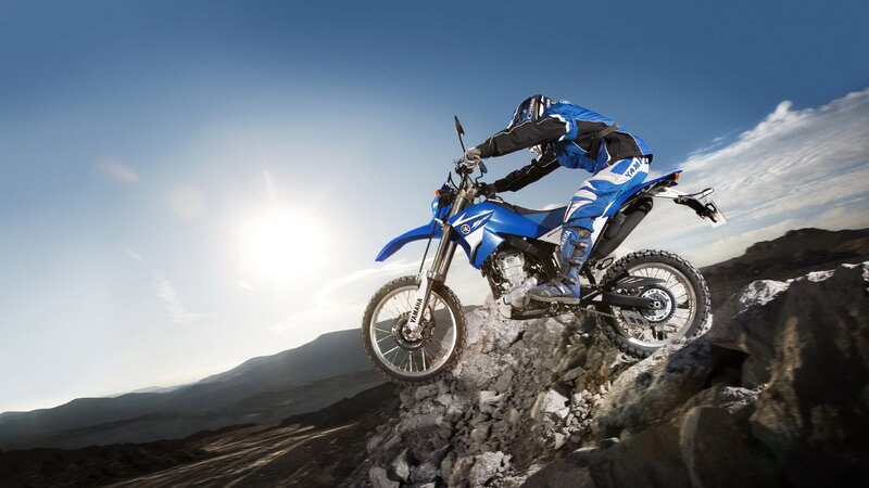Motorcycle rider on rocky terrain