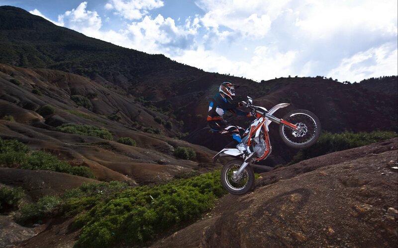 Motorcycle rider on rocky terrain