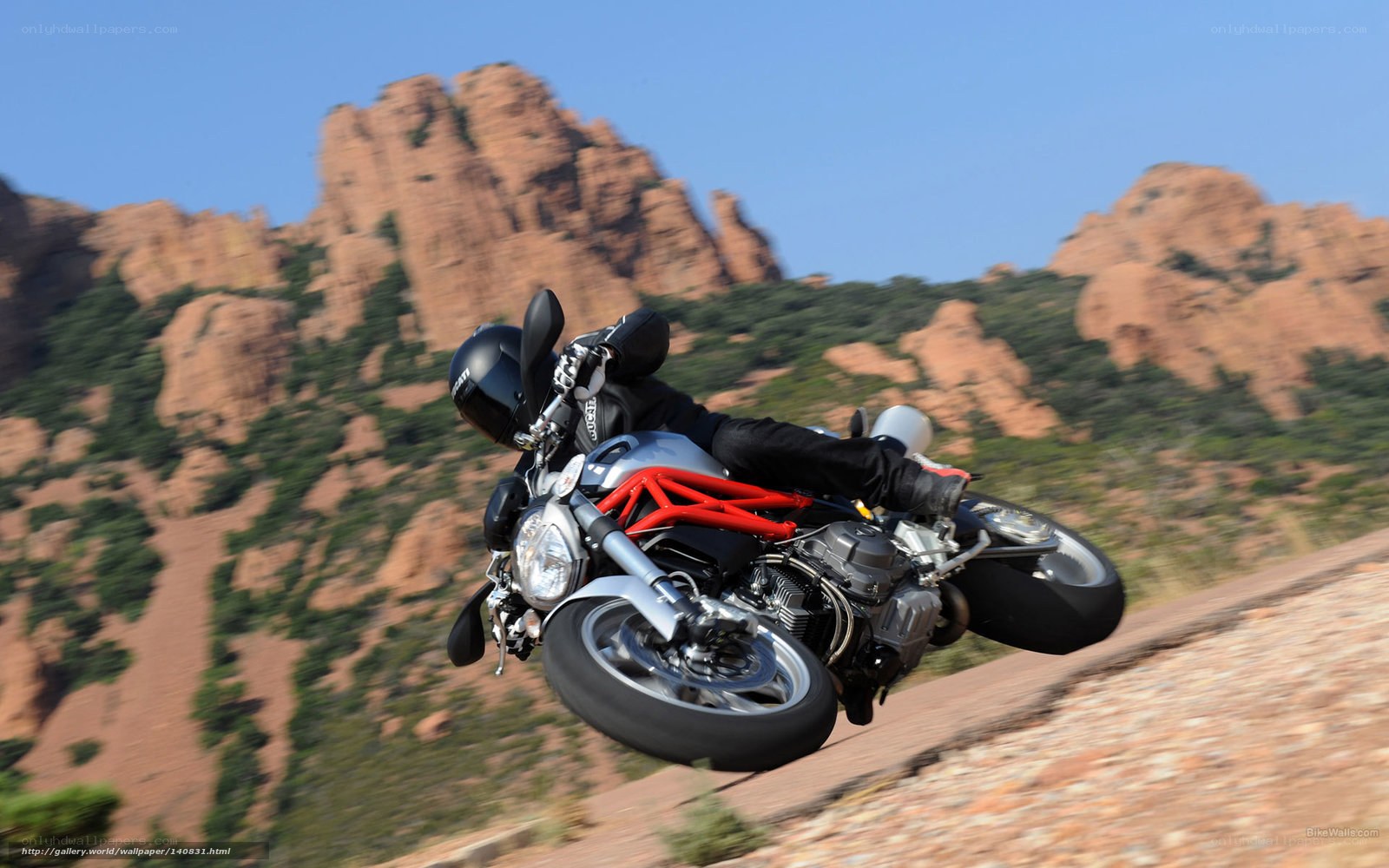 motorcycle rider on rocky terrain