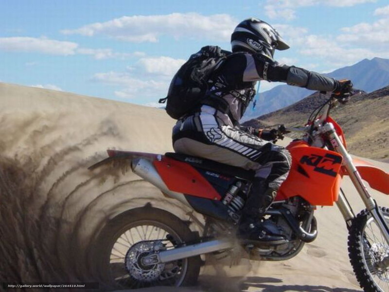 motorcycle rider on sand dune