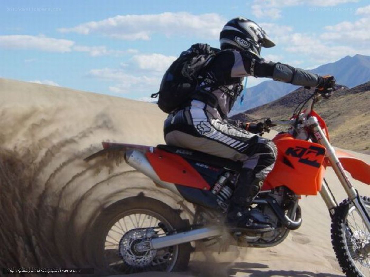 motorcycle rider on sand dune