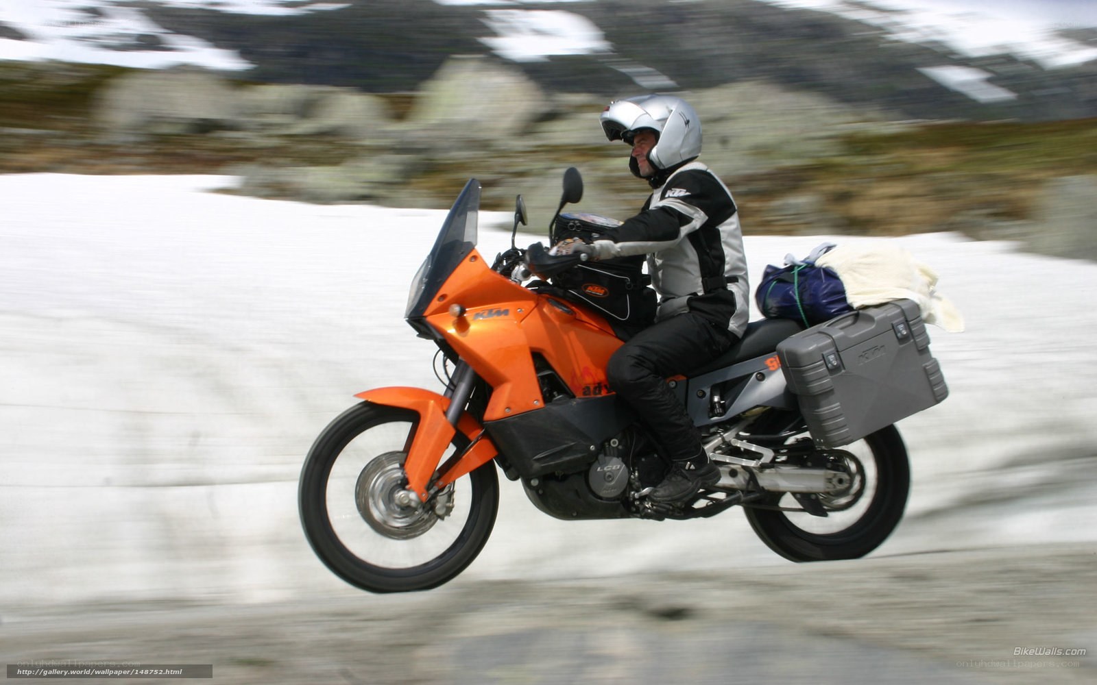 motorcycle rider on snowy road