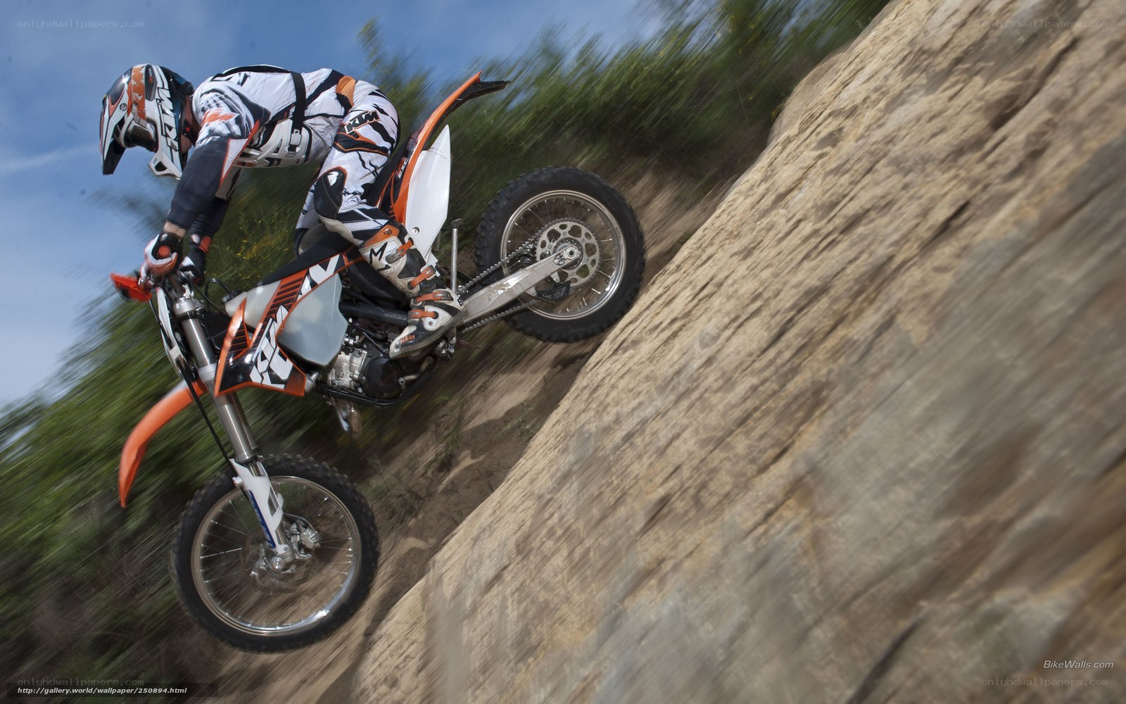Motorcycle rider on steep incline