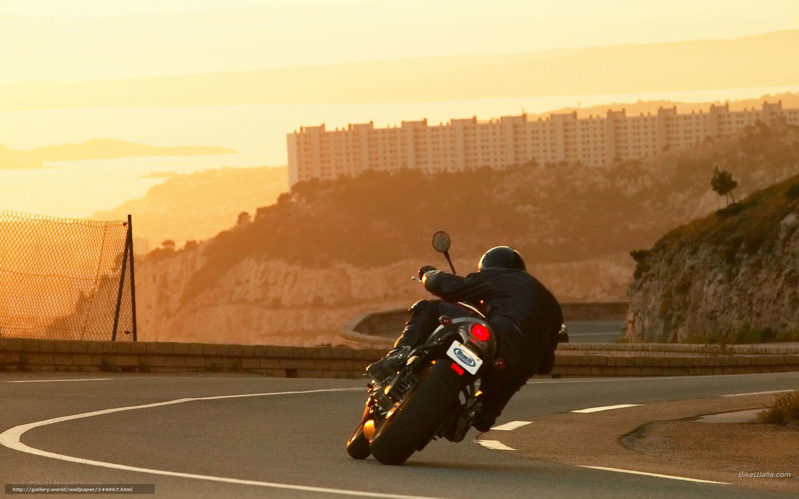 Motorcycle rider on winding road