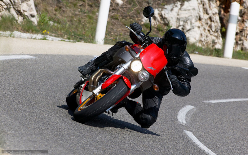 motorcycle rider on winding road