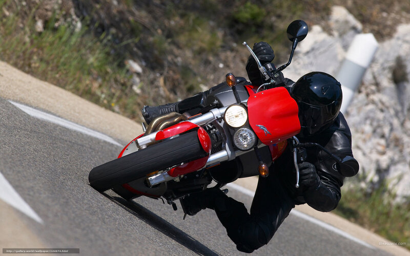 motorcycle rider on winding road