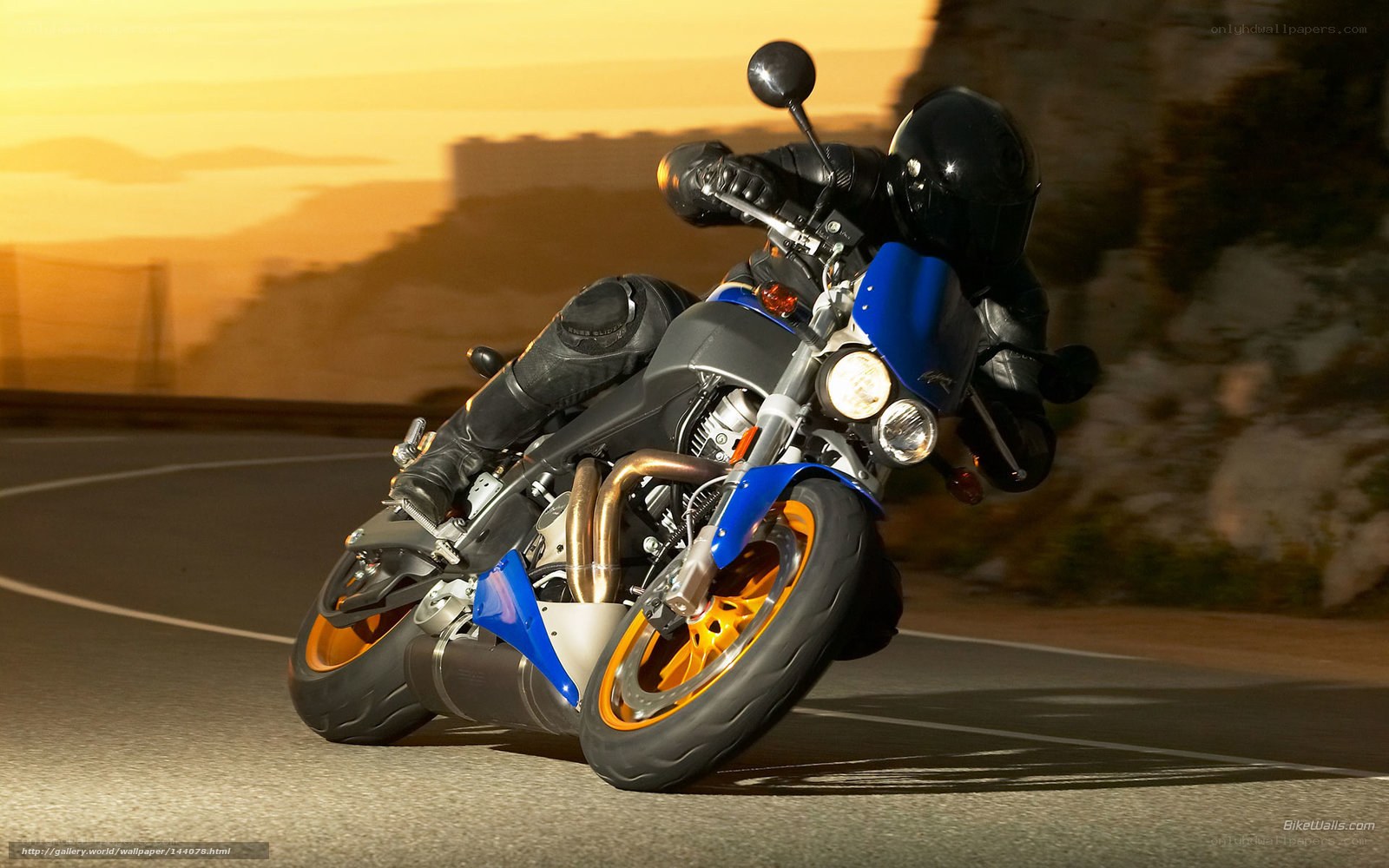 motorcycle rider on winding road