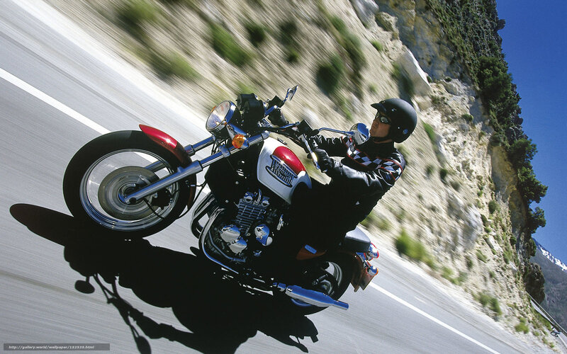 Motorcycle rider on winding road