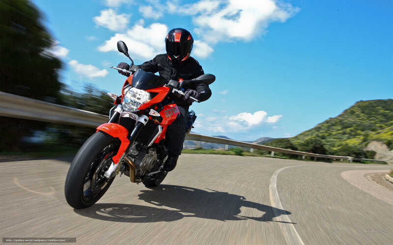motorcycle rider on winding road