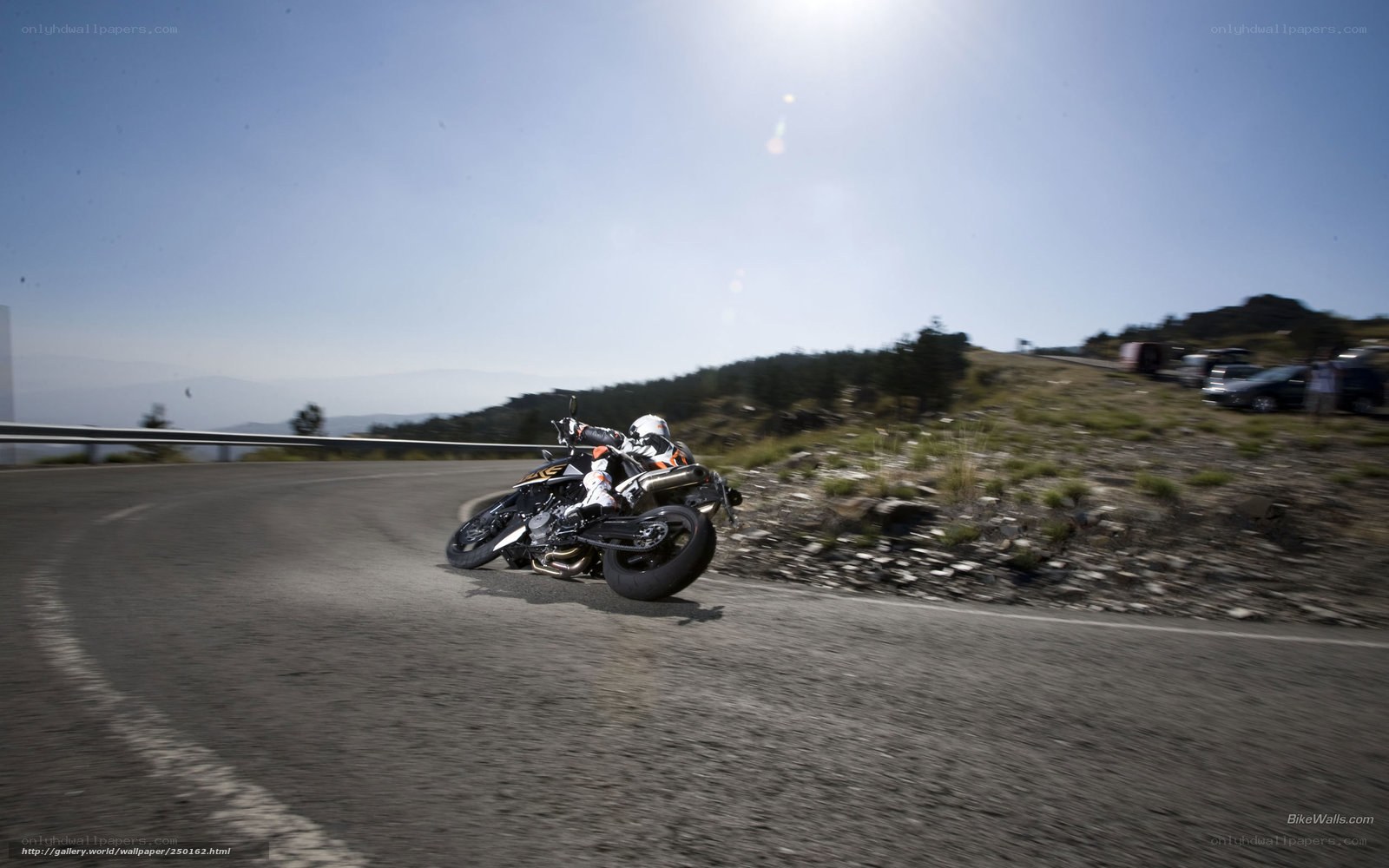 Motorcycle rider on winding road
